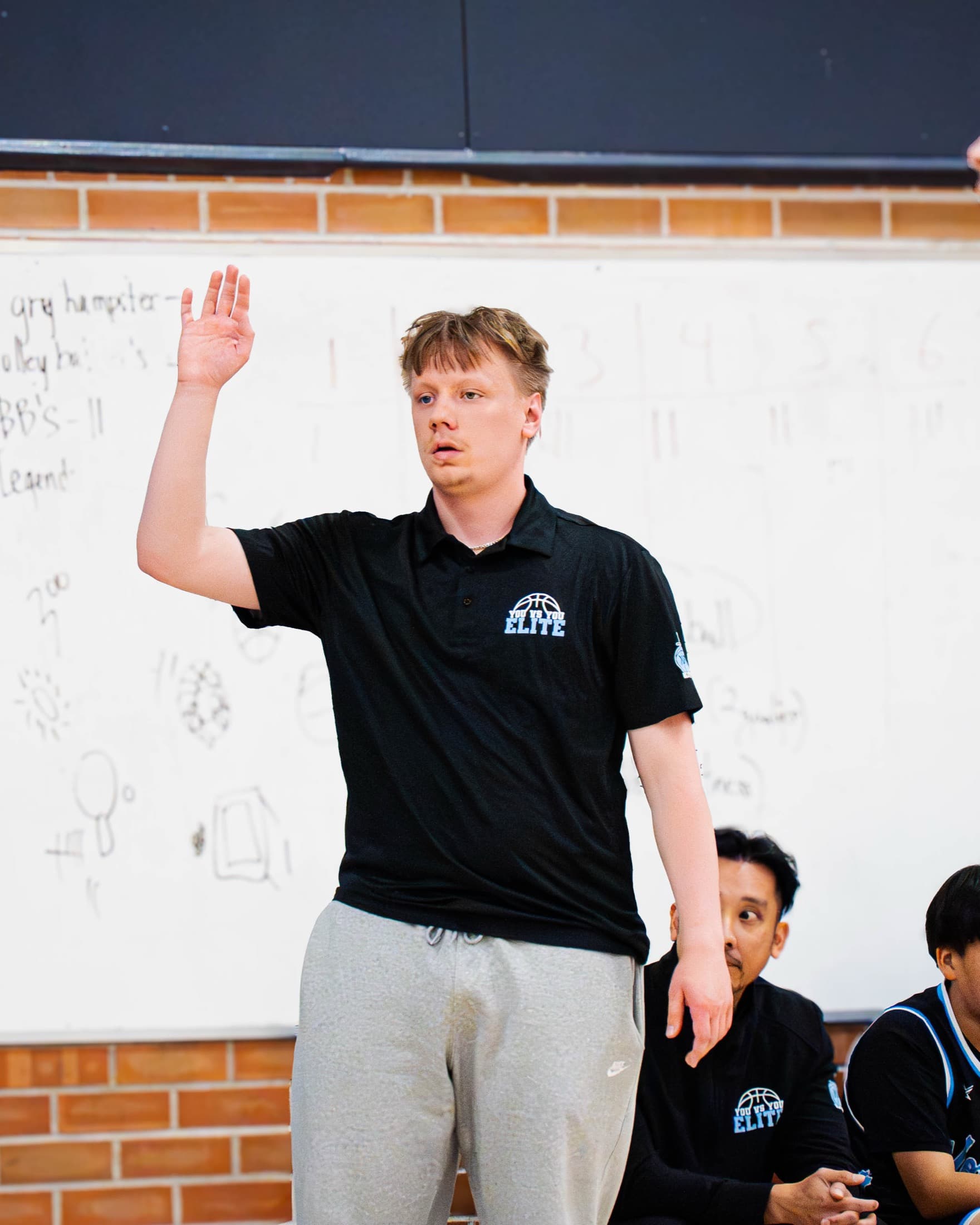 A coach talking to their team