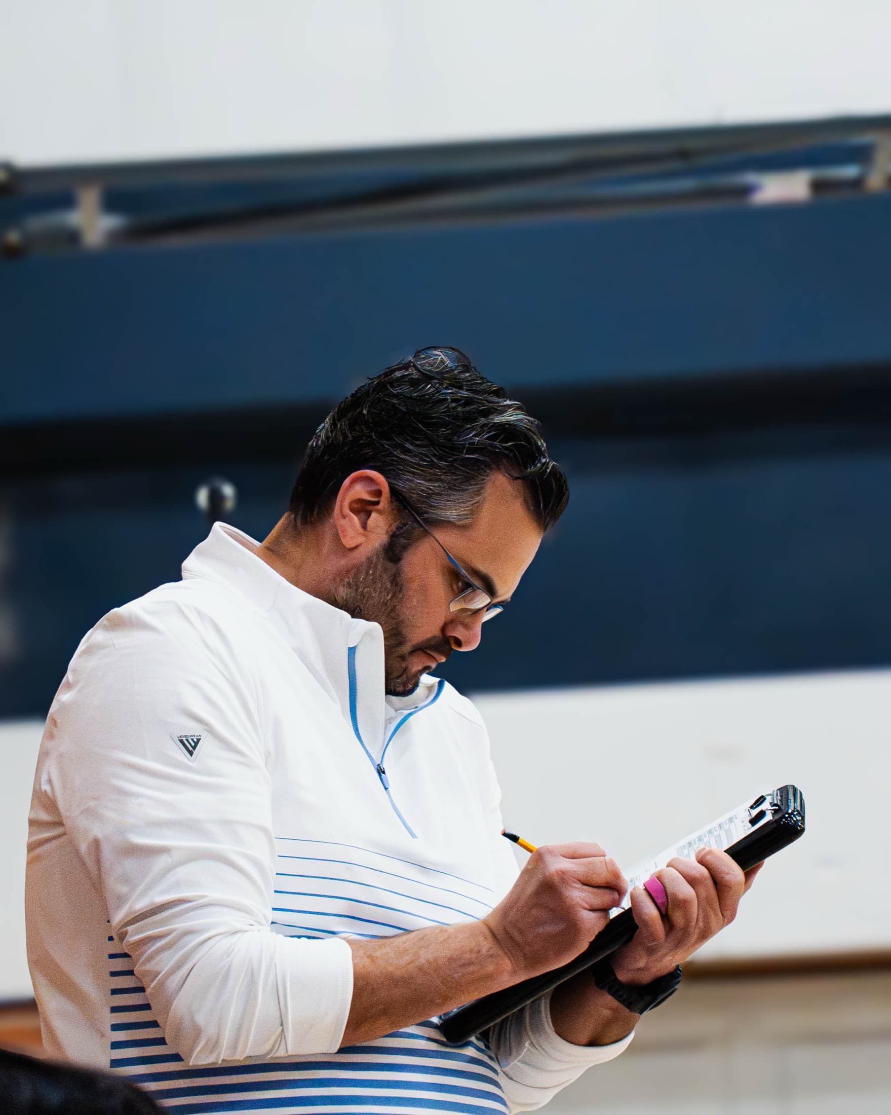 A scorekeeper working the table during a game