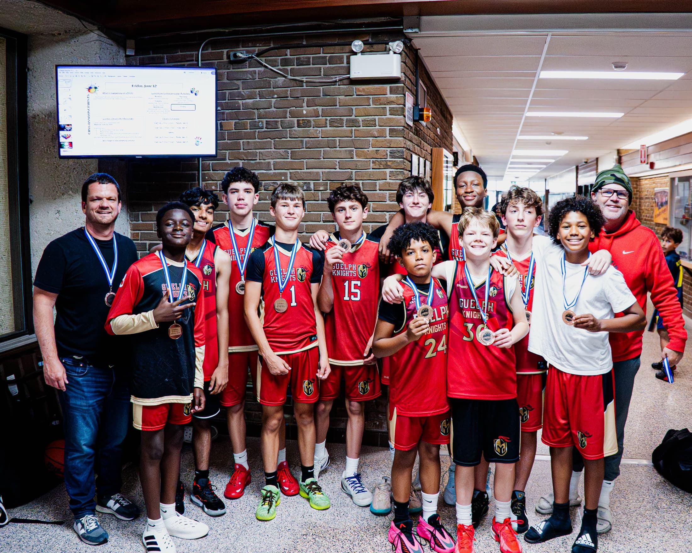 A team gathered together with their medals